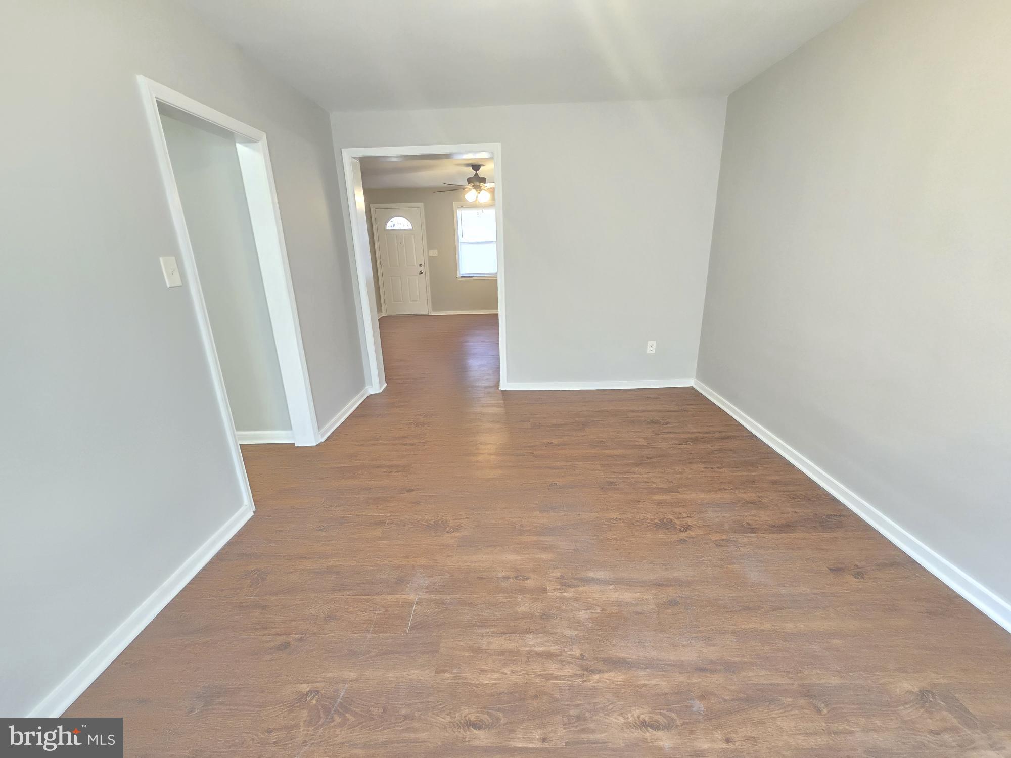 1225 Cochran Avenue Baltimore, MD 21239 - Photo 5 of 22 wooden floor in an empty room