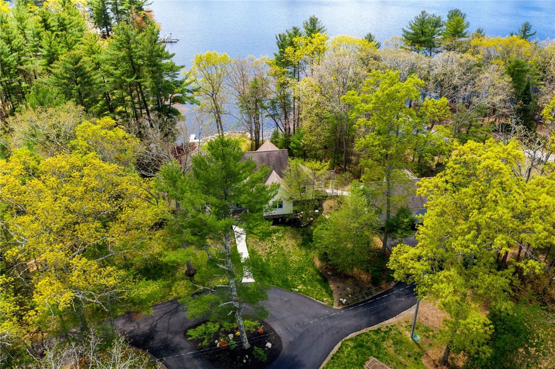 77 Raymonds Point Road Coventry, RI 02816 - Photo 13 of 50 Aerial view of the circular driveway, house and pond.