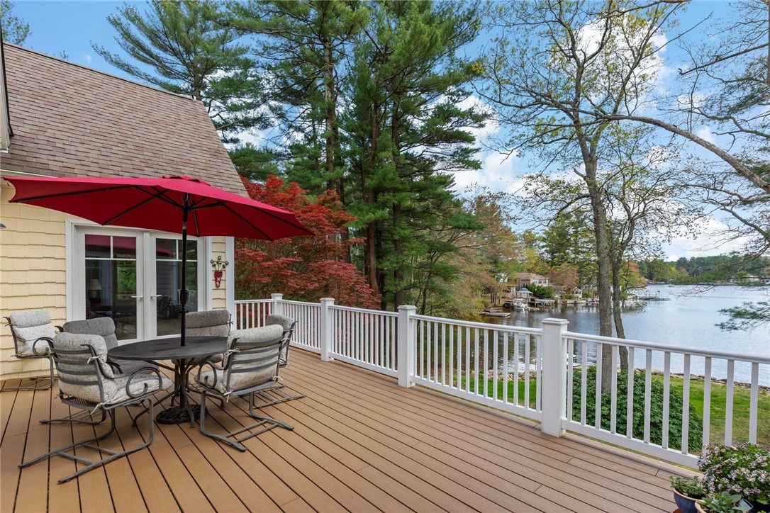 77 Raymonds Point Road Coventry, RI 02816 - Photo 29 of 50 Maintenance-free Trex deck with PVC railings and posts, looking out over Johnson's Pond. French doors leading into the owner's suite.