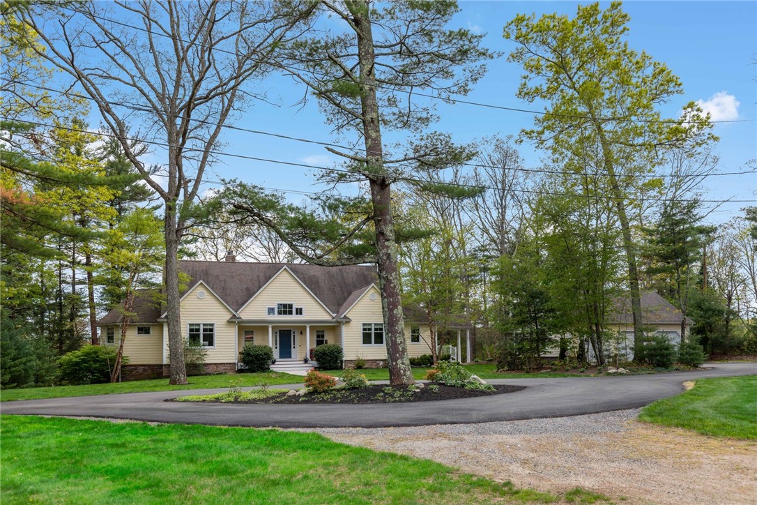 77 Raymonds Point Road Coventry, RI 02816 - Photo 3 of 50 Front of house from field, showing circular drive and detached garage to the right.