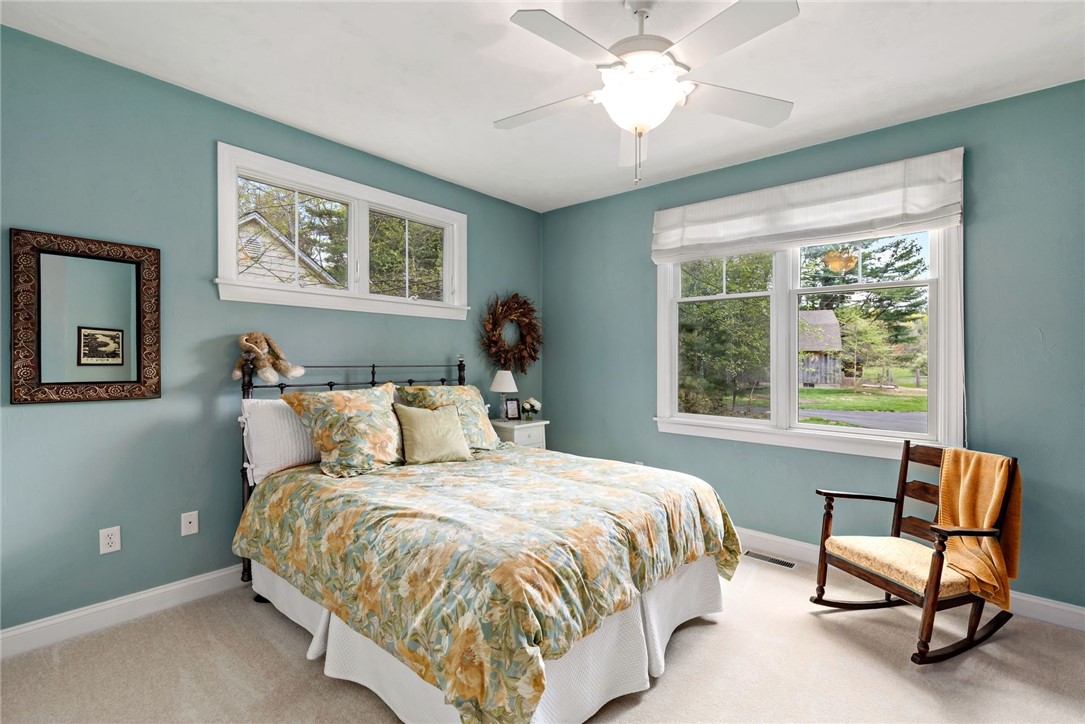 77 Raymonds Point Road Coventry, RI 02816 - Photo 40 of 50 Main level bedroom #2 with view of circular drive, barn and fields.