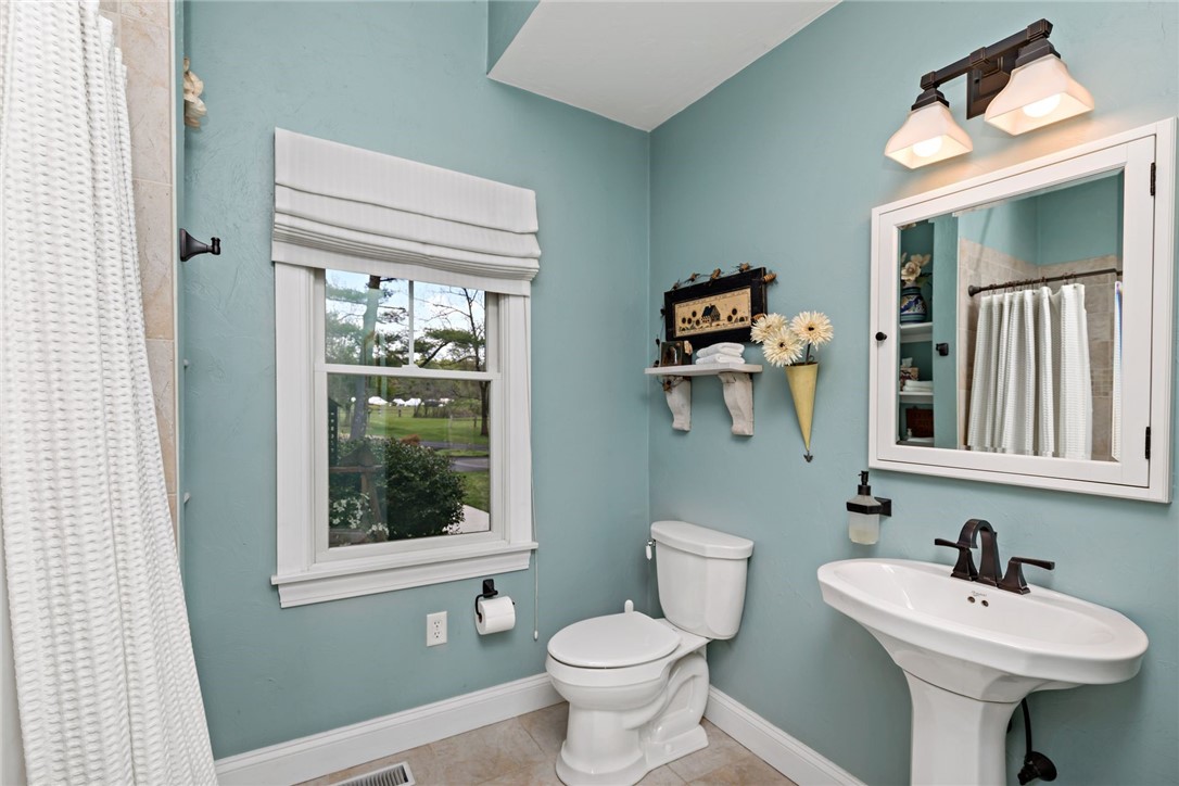 77 Raymonds Point Road Coventry, RI 02816 - Photo 42 of 50 Main level bathroom #2 with tile floor and shower.