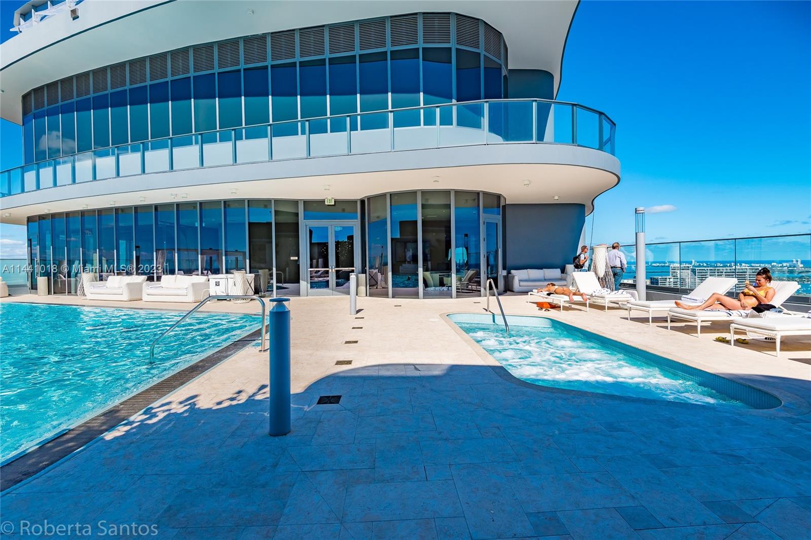 1000 Brickell Plaza, Unit PH5802 Miami, FL 33131 - Photo 11 of 13 a view of swimming pool with an outdoor seating