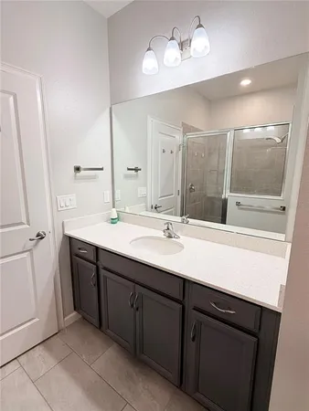 a bathroom with a sink double vanity and a mirror