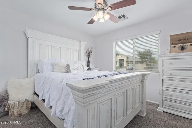 a spacious bathroom with a granite countertop sink a mirror and a shower