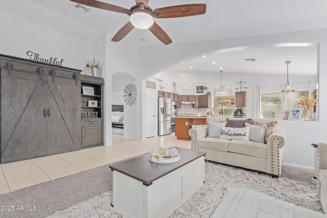 a living room with furniture and a table