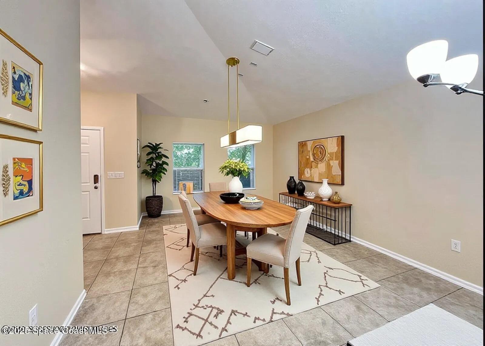 1877 Attilburgh Boulevard West Melbourne, FL 32904 - Photo 6 of 19 a view of a dining room with furniture