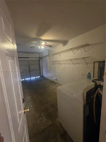 a view of street with red and white house