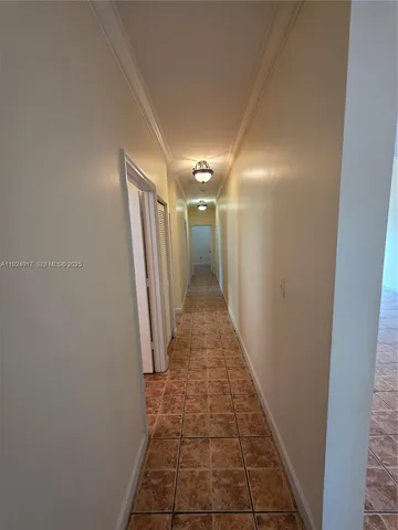 an empty room with a empty space and windows