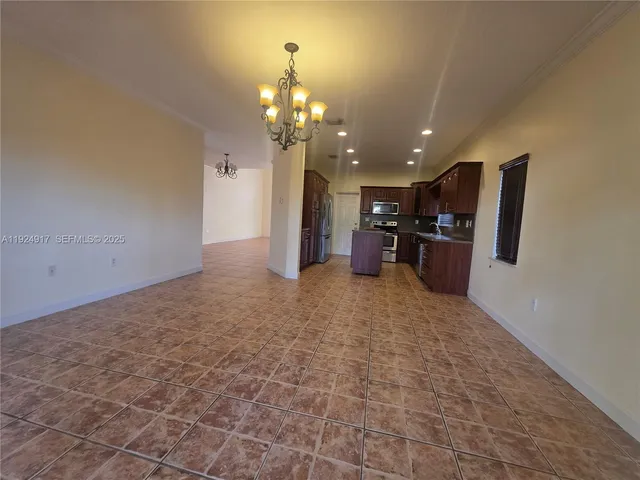 a view of a pathway of a house with a yard