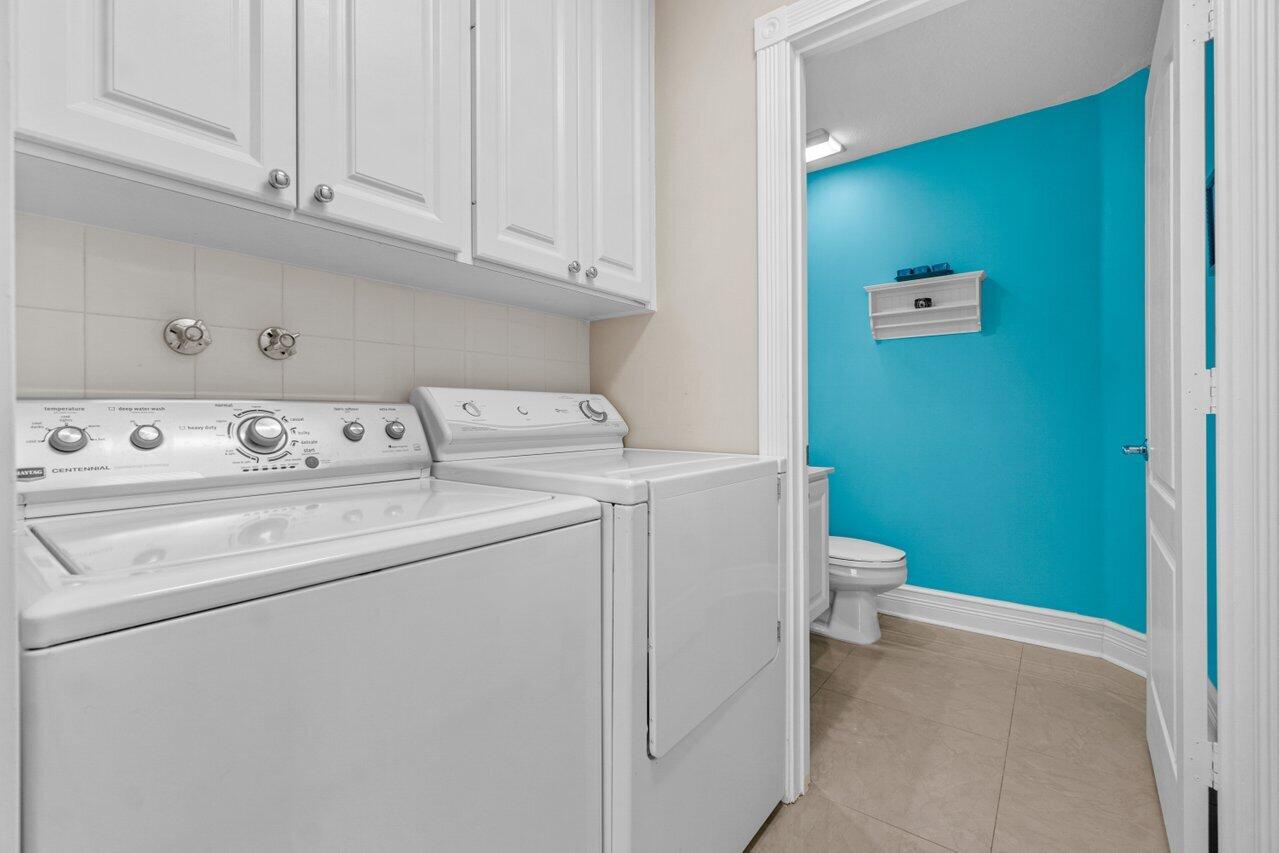107 Andover Drive Jupiter, FL 33458 - Photo 24 of 26 a utility room with dryer and washer