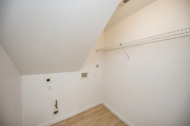 a view of a room with racks on the wall