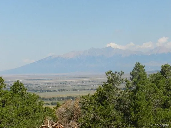 a view of a large body of water and beach