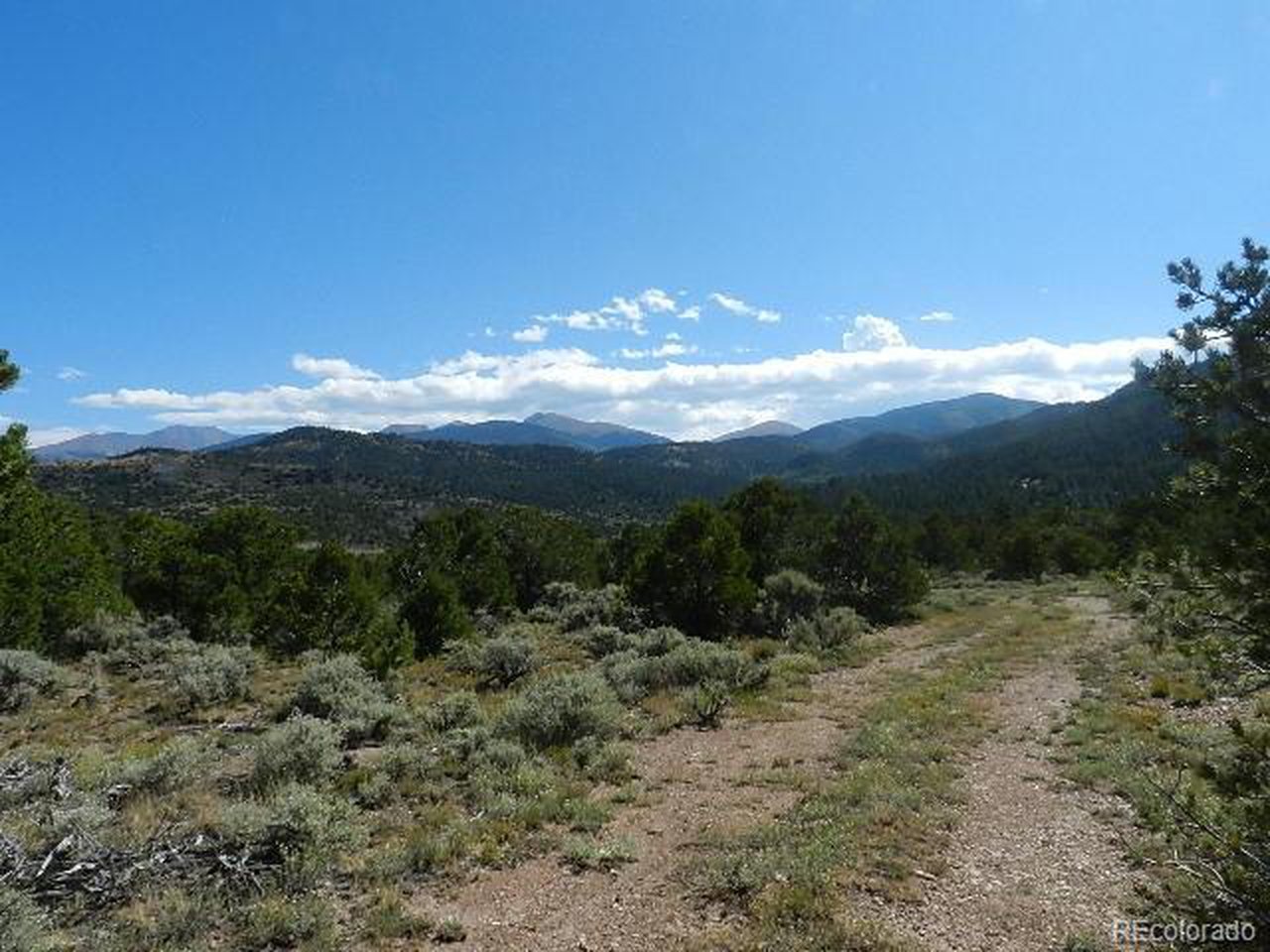 8 Mountain Ridge Lane San Luis, CO 81152 - Photo 18 of 28 a view of a city with lush green forest