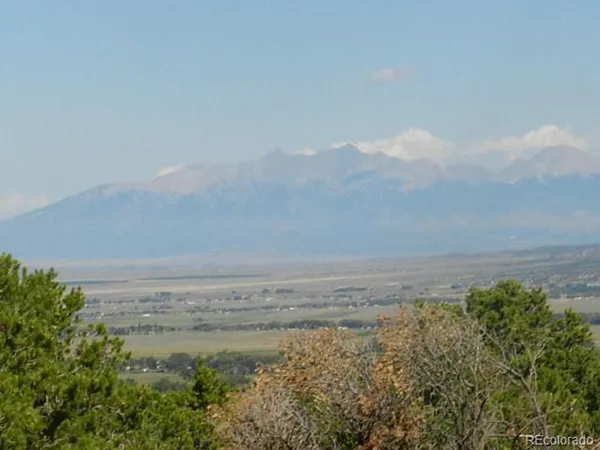 a view of an ocean beach and mountain