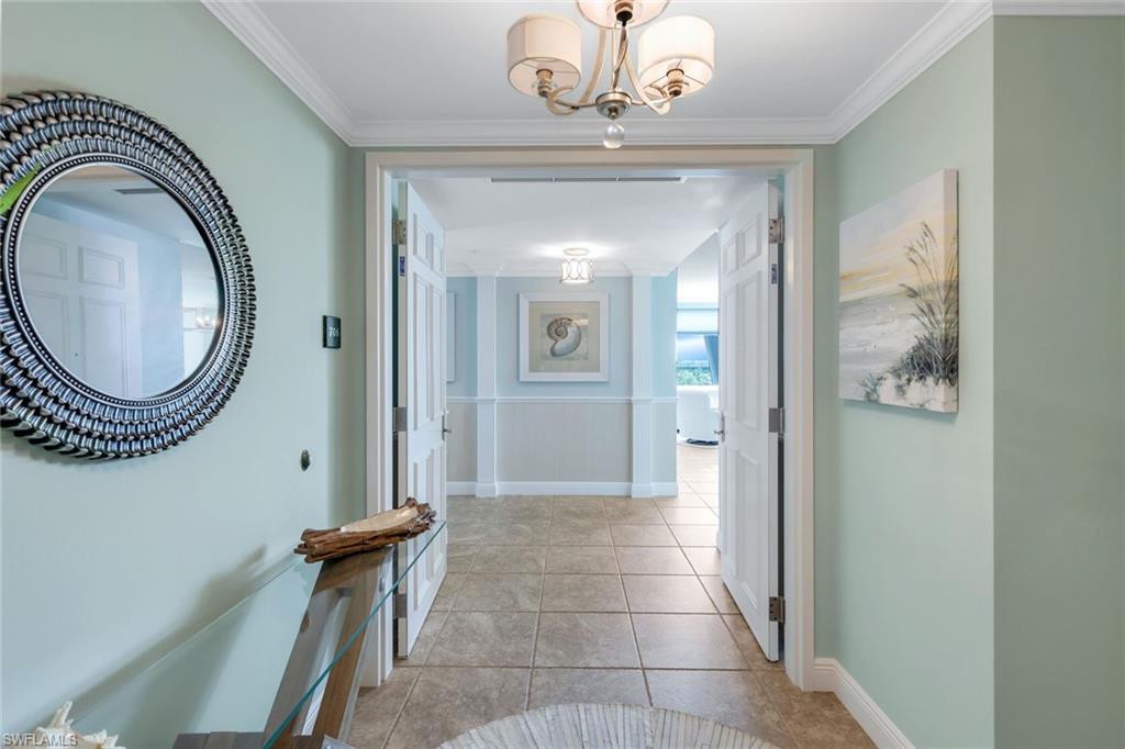 275 Indies Way, Unit 706 Naples, FL 34110 - Photo 16 of 50 a view of a hallway with windows