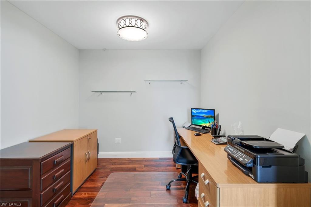 275 Indies Way, Unit 706 Naples, FL 34110 - Photo 17 of 50 a room with a desk and a workspace