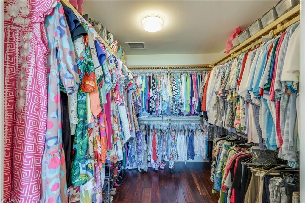 275 Indies Way, Unit 706 Naples, FL 34110 - Photo 22 of 50 a view of walk in closet with clothes