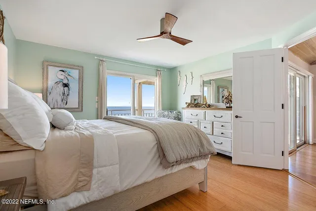 a spacious bathroom with a double vanity sink a mirror and a shower