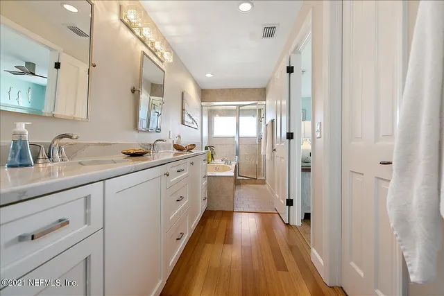 a bathroom with a bathtub and a shower
