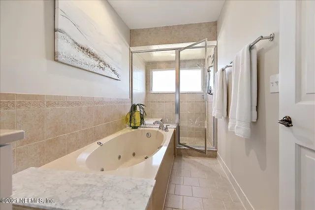 a bathroom with a glass shower door