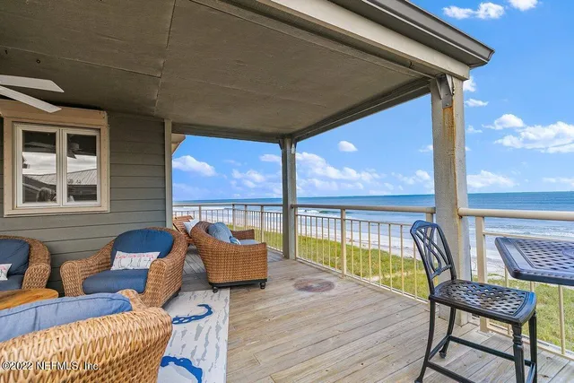 a view of a balcony with furniture