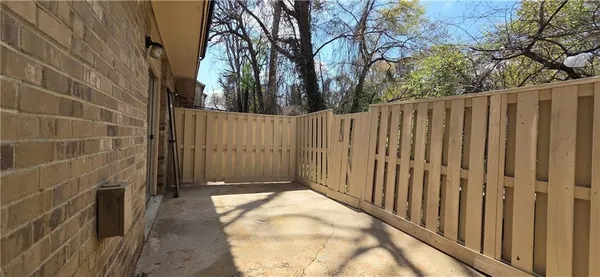 a view of a wooden fence