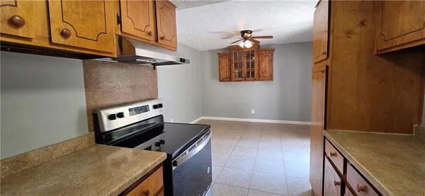 a kitchen with a stove and a microwave