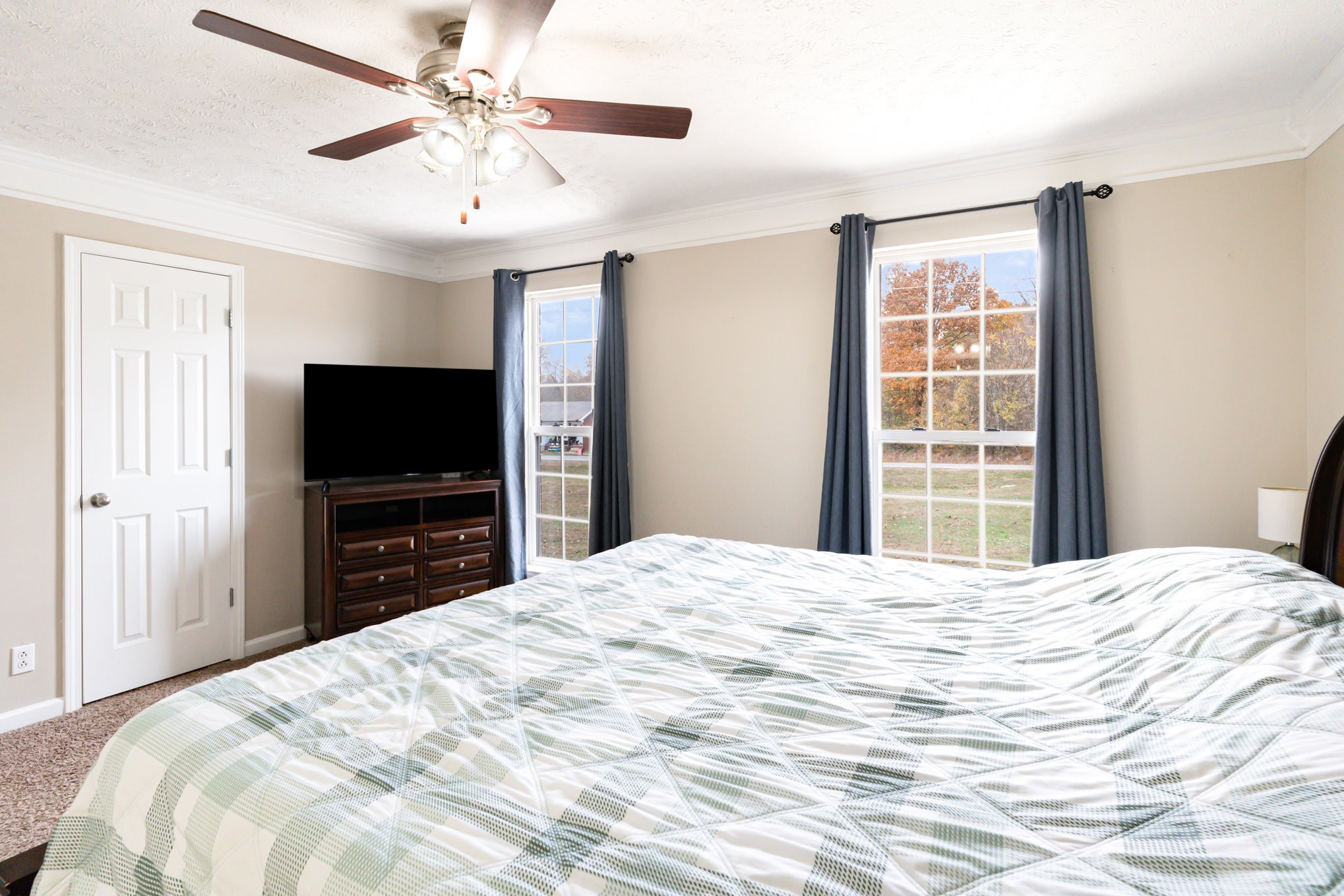 3075 Bowker Road Charlotte, TN 37036 - Photo 12 of 28 a bedroom with a bed and a flat screen tv