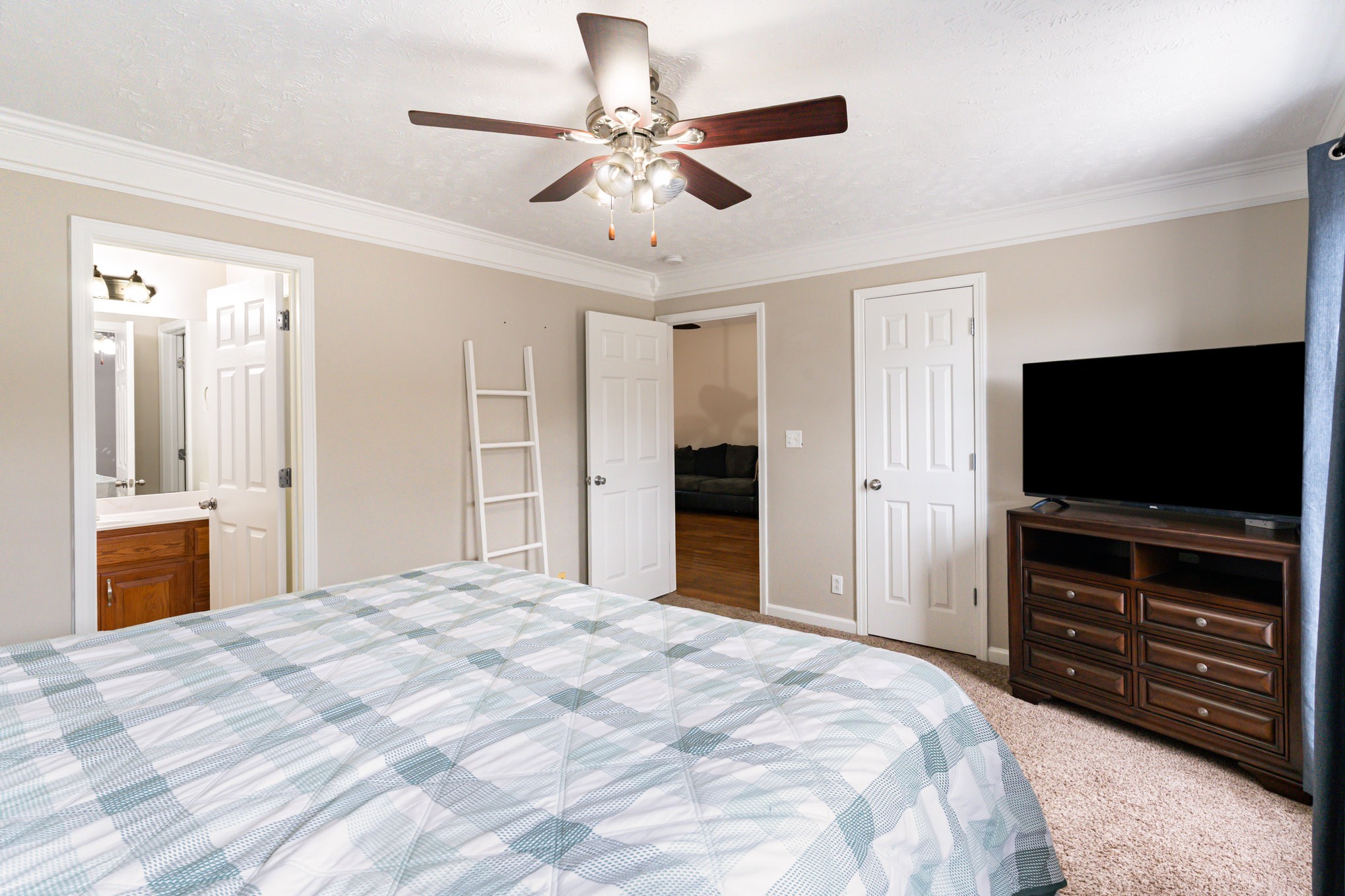 3075 Bowker Road Charlotte, TN 37036 - Photo 13 of 28 a bedroom with a bed and a flat screen tv