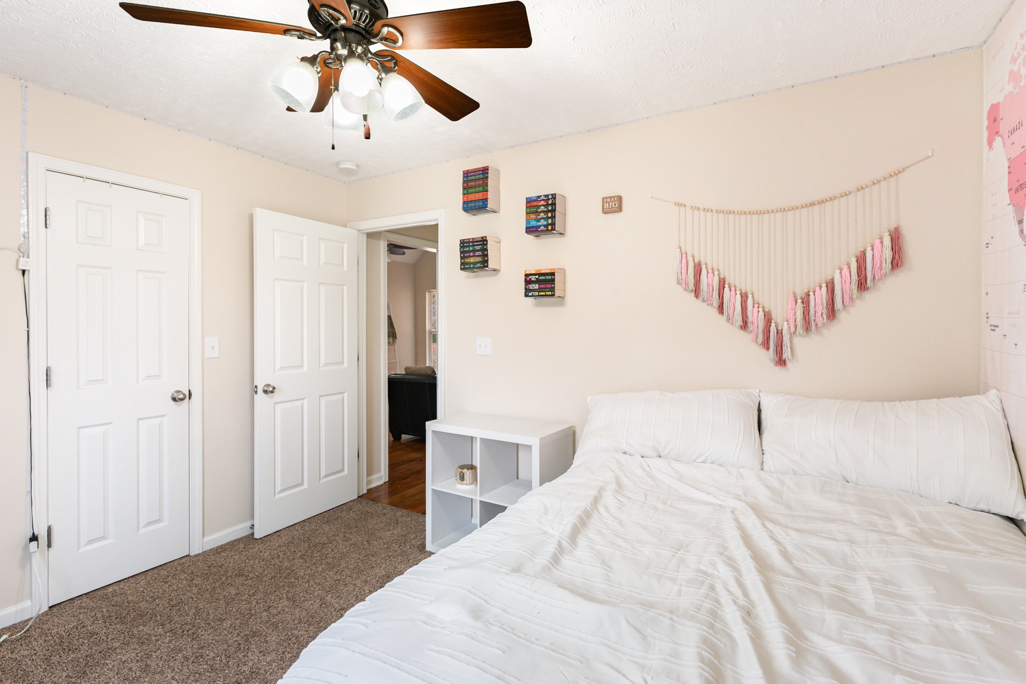 3075 Bowker Road Charlotte, TN 37036 - Photo 16 of 28 a bedroom with a bed and a chandelier