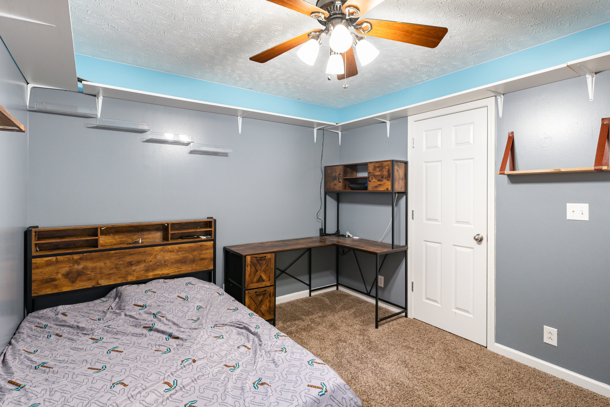 3075 Bowker Road Charlotte, TN 37036 - Photo 18 of 28 a bedroom with a bed and a chandelier