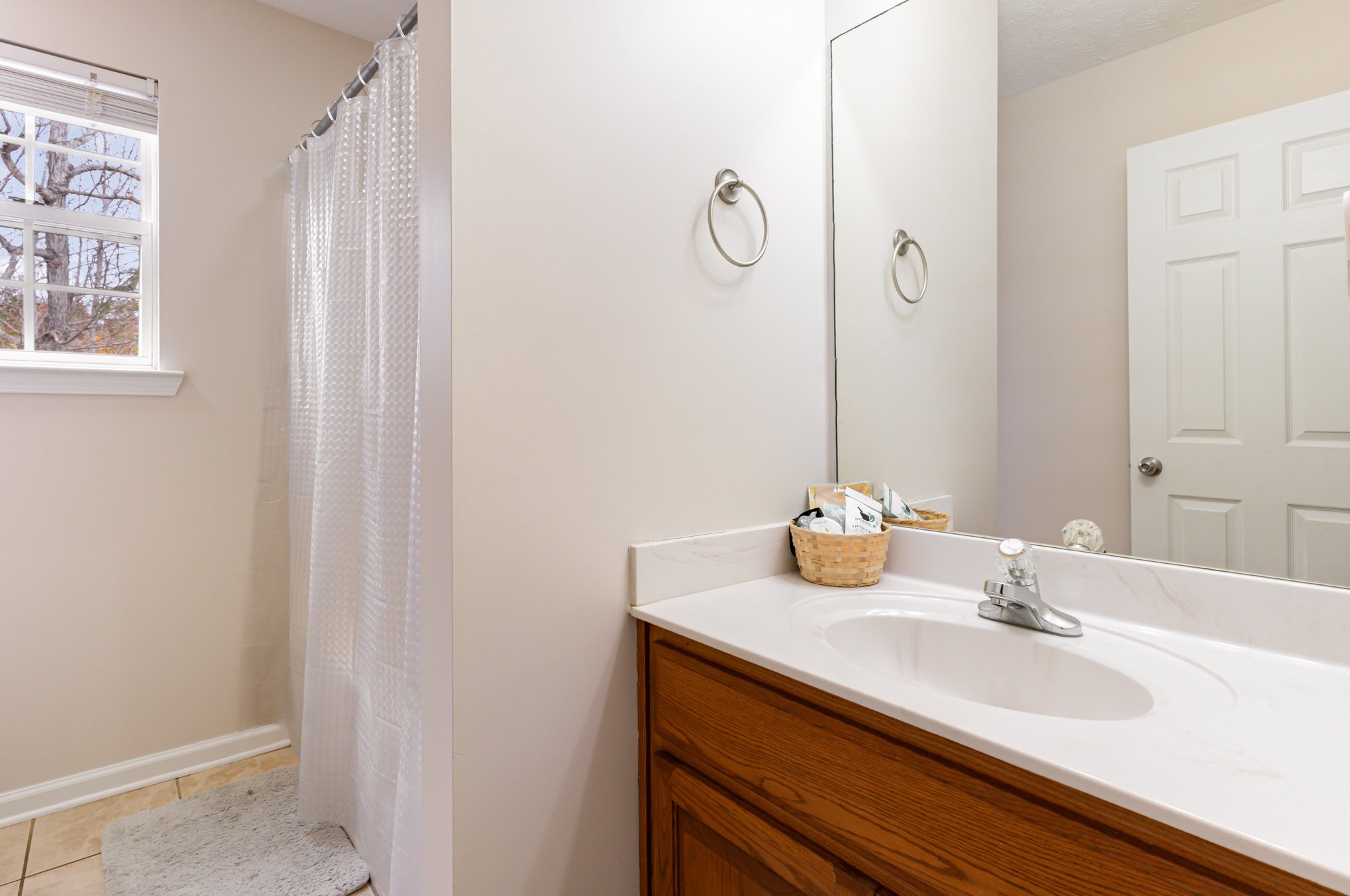 3075 Bowker Road Charlotte, TN 37036 - Photo 19 of 28 a bathroom with a sink and a mirror