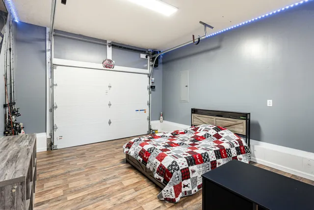 a bedroom with a bed and a table