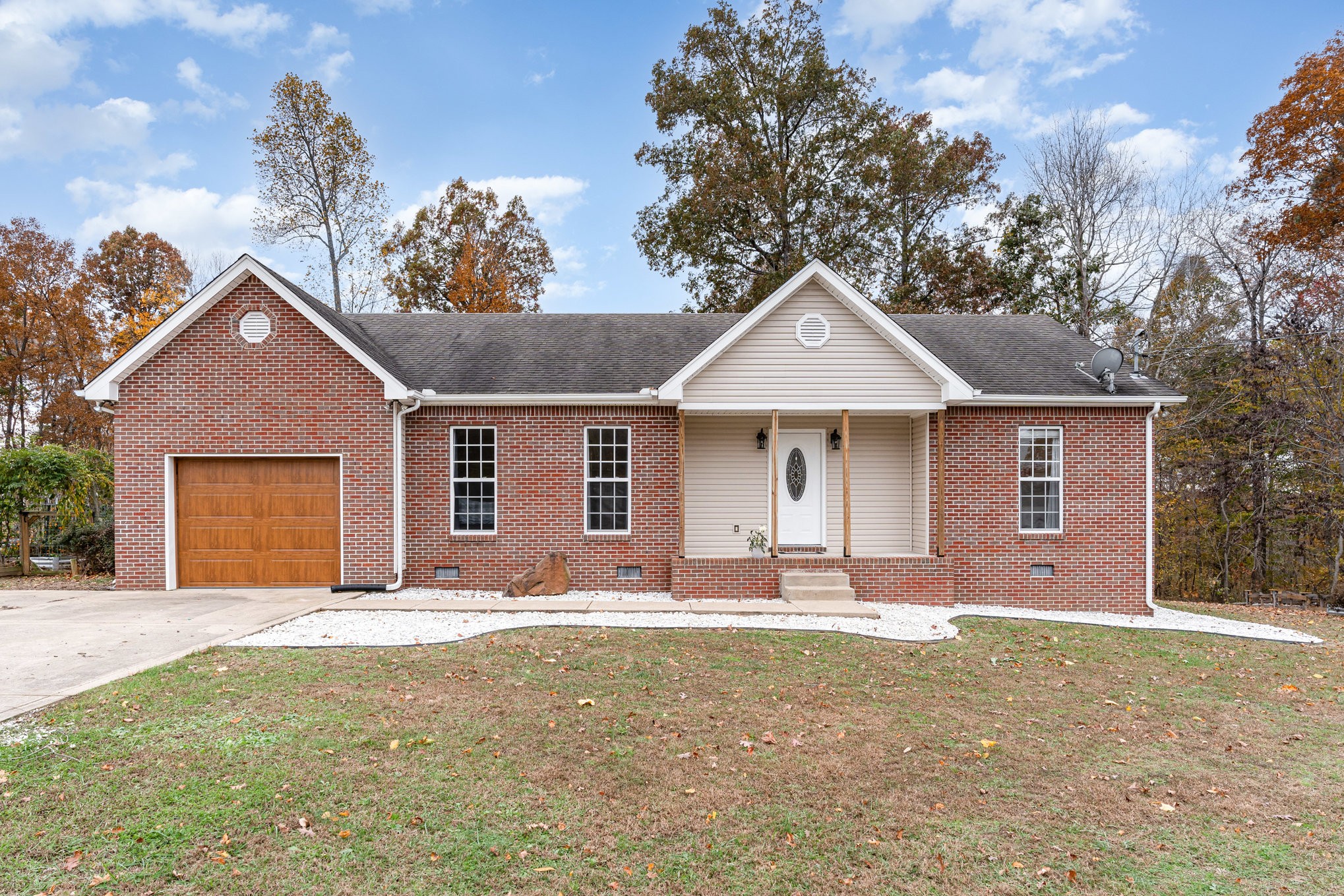 3075 Bowker Road Charlotte, TN 37036 - Photo 2 of 28 a front view of a house with a yard