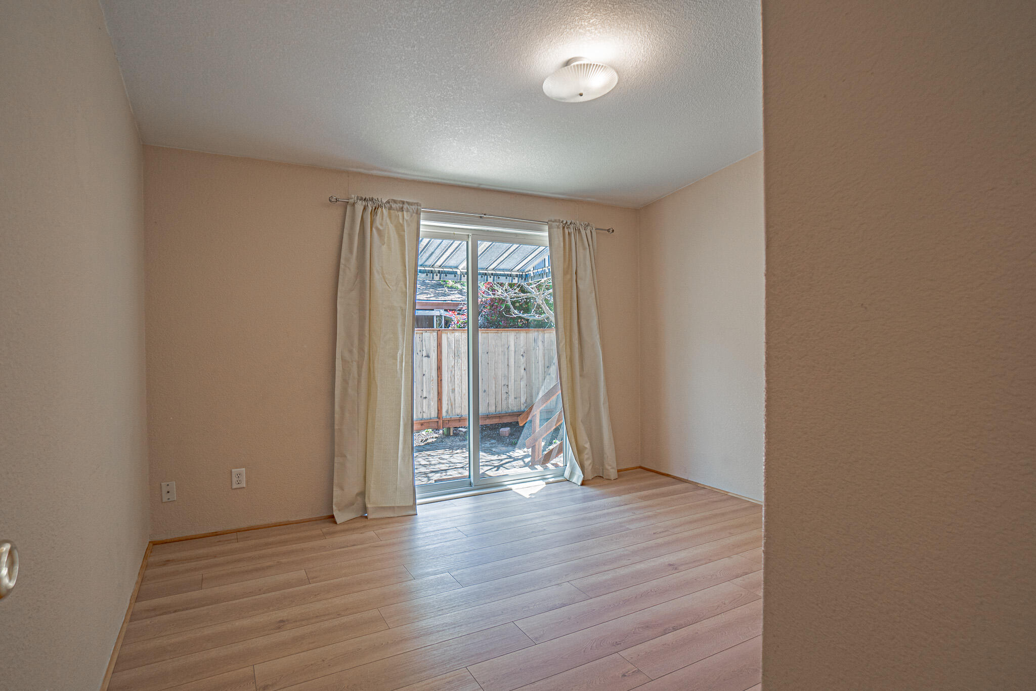 215 Tolman Creek Road, Unit 38 Ashland, OR 97520 - Photo 22 of 32 Guest Bedroom with Slider to Side Yard
