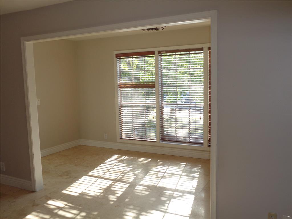 5048 Heatherhill Lane, Unit 1204 Boca Raton, FL 33486 - Photo 11 of 31 a view of an empty room with a window