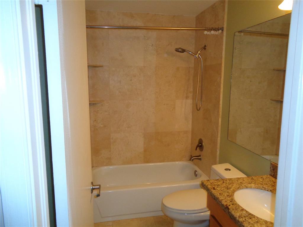 5048 Heatherhill Lane, Unit 1204 Boca Raton, FL 33486 - Photo 15 of 31 a bathroom with a granite countertop bathtub shower sink vanity and toilet