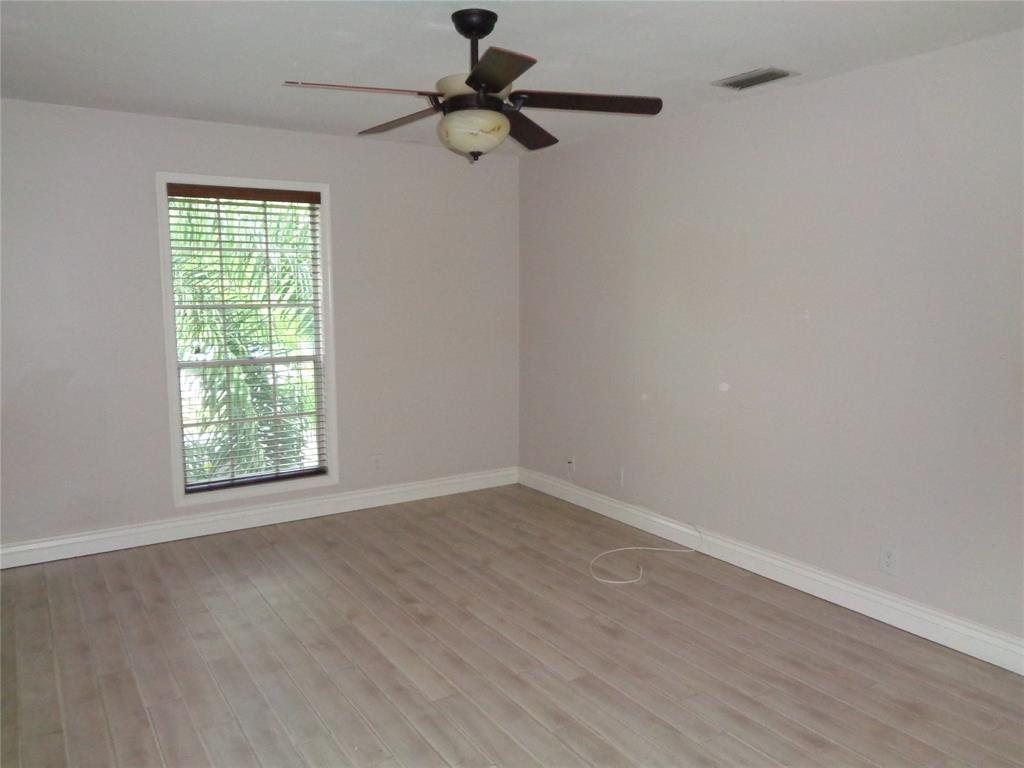 5048 Heatherhill Lane, Unit 1204 Boca Raton, FL 33486 - Photo 17 of 31 a view of a window in an empty room