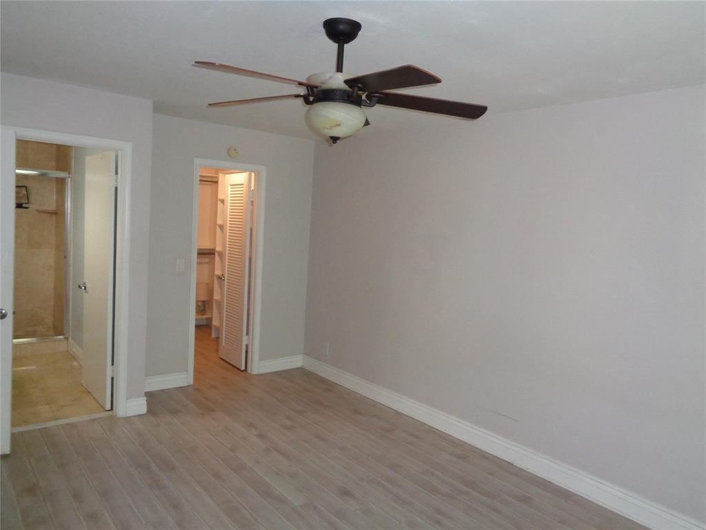 5048 Heatherhill Lane, Unit 1204 Boca Raton, FL 33486 - Photo 21 of 31 a view of a room with a barbeque and wooden floor