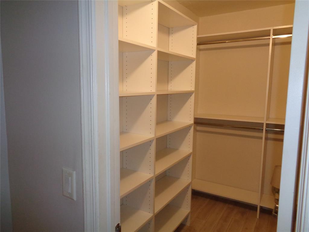 5048 Heatherhill Lane, Unit 1204 Boca Raton, FL 33486 - Photo 22 of 31 a view of walk in closet with empty racks