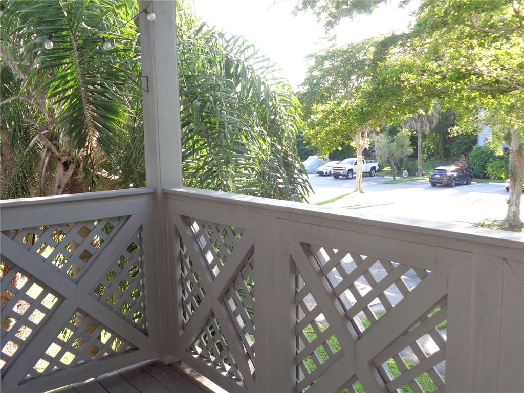 5048 Heatherhill Lane, Unit 1204 Boca Raton, FL 33486 - Photo 24 of 31 a view of a wooden street from a balcony