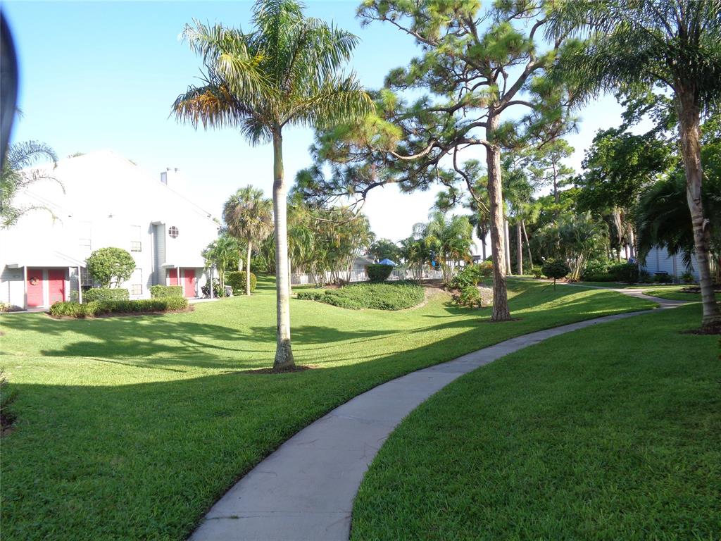 5048 Heatherhill Lane, Unit 1204 Boca Raton, FL 33486 - Photo 27 of 31 a view of a park with palm trees