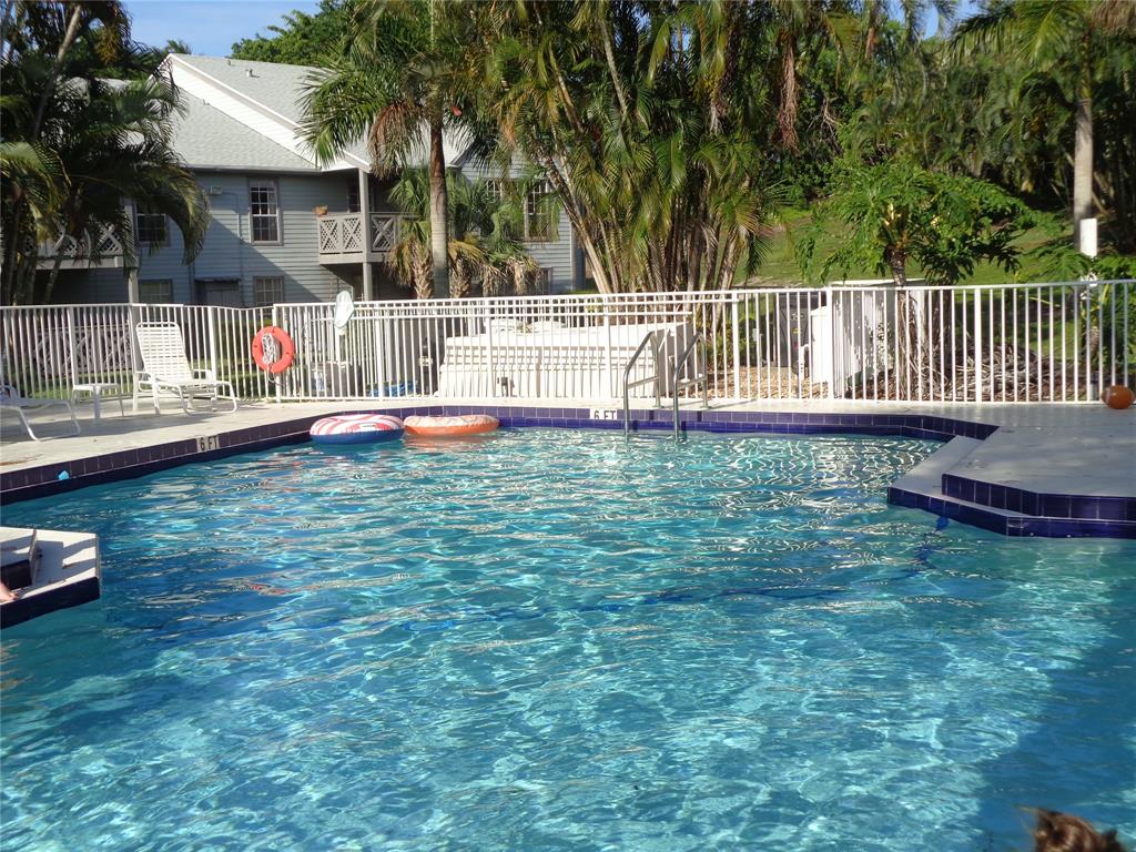 5048 Heatherhill Lane, Unit 1204 Boca Raton, FL 33486 - Photo 28 of 31 a view of a house with backyard and sitting area
