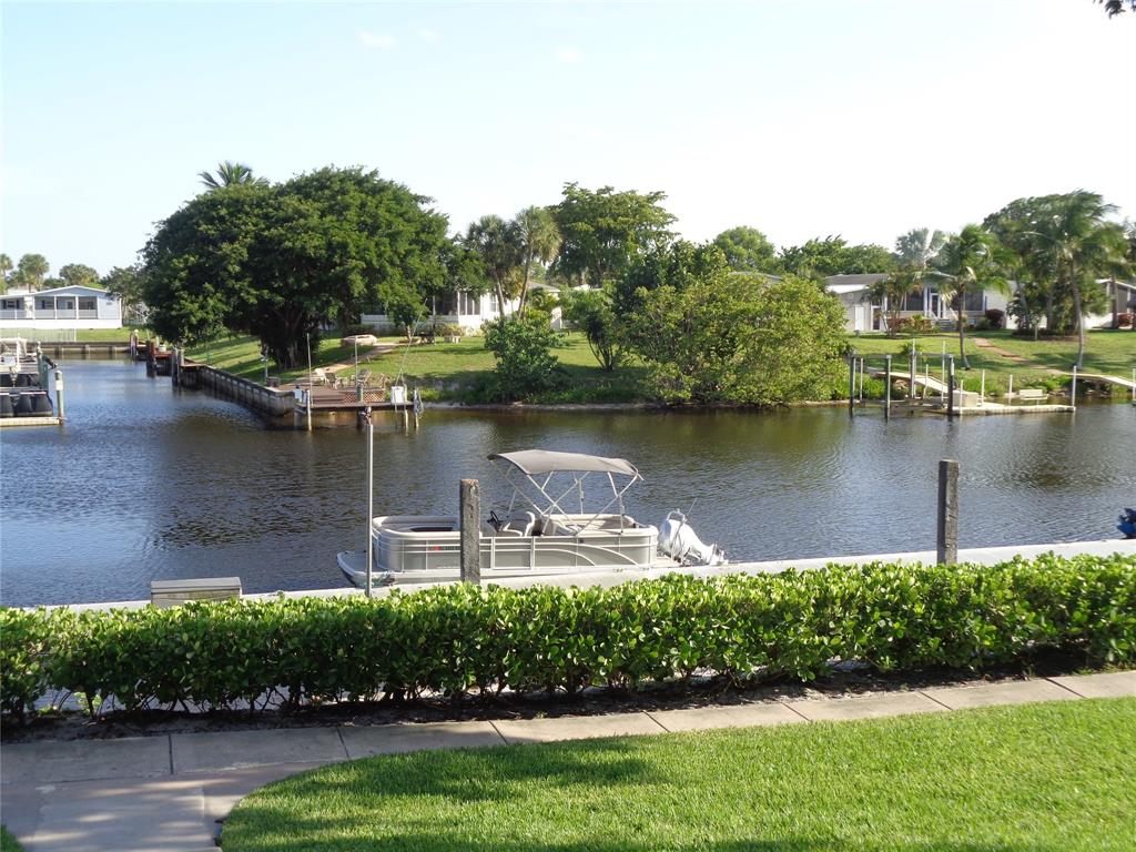 5048 Heatherhill Lane, Unit 1204 Boca Raton, FL 33486 - Photo 29 of 31 an aerial view of a house with a yard and lake view