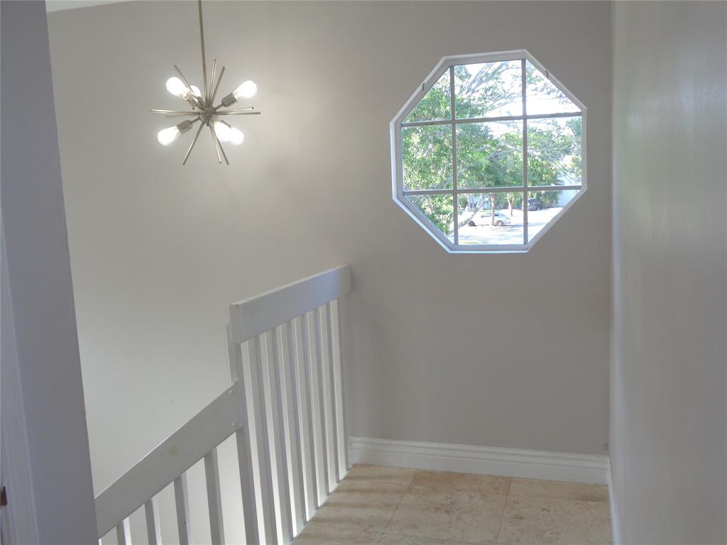 5048 Heatherhill Lane, Unit 1204 Boca Raton, FL 33486 - Photo 7 of 31 an empty room that has a window in it