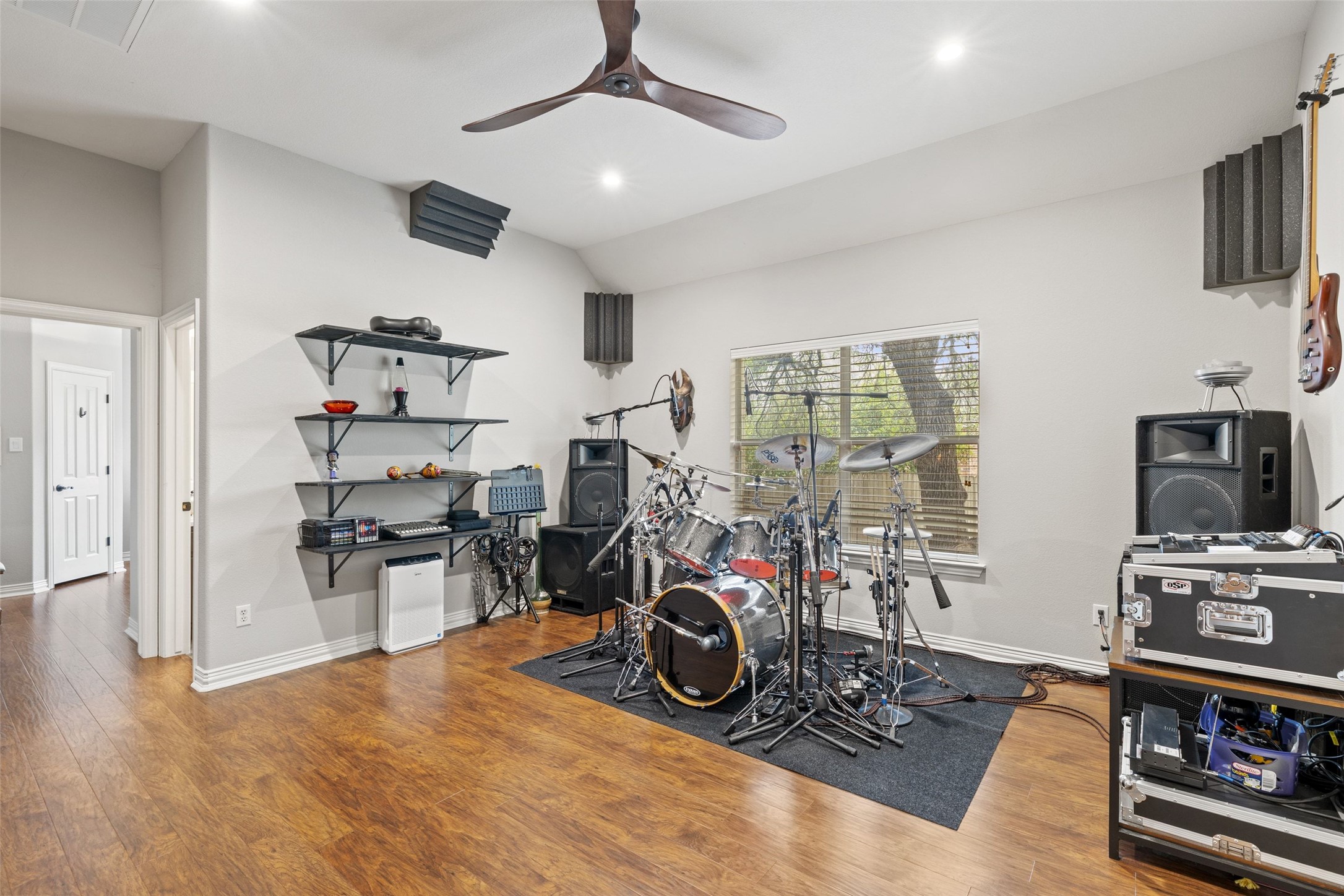 15208 Nightingale Lane Austin, TX 78734 - Photo 27 of 40 Secondary living space with vaulted ceiling, a ceiling fan, wood finished floors, and recessed lighting. Perfect for a hobby or creative space.