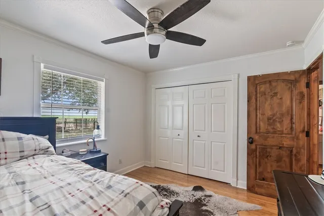 a bedroom with a bed and a window