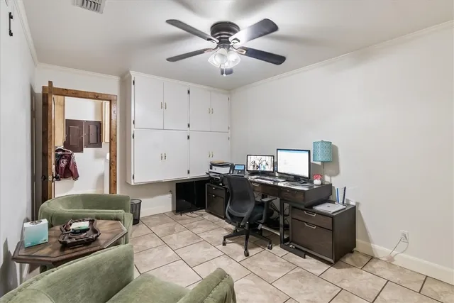 a workspace with furniture and window