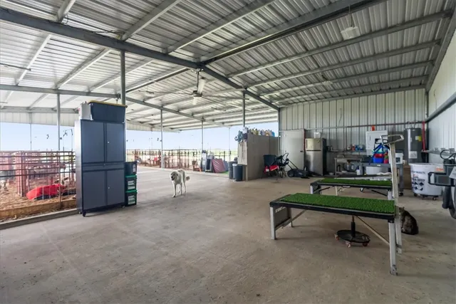 an aerial view of a house with a lake view